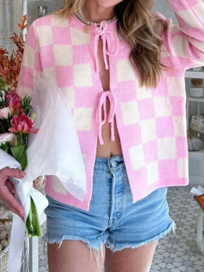 Trendsi Tie-Front Cropped Cardigan pink and cream checkered knit sweater paired with denim shorts holding flowers