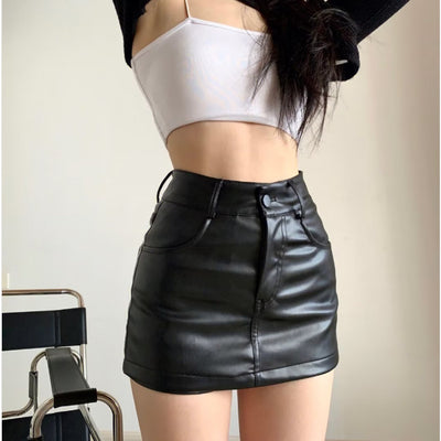 Trendsi model wearing high waisted black Leather Mini Skirt with white cropped cami top