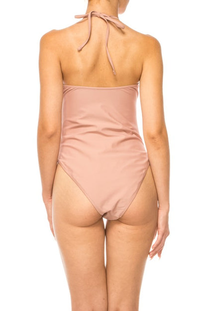 Back view of Mermaid Swimwear Floral Wrap one-piece swimsuit in solid light pink color