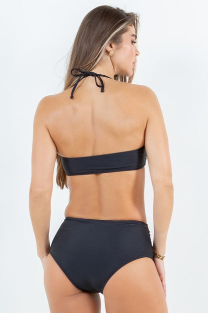 Back view of woman wearing black Mermaid Swimwear High Waist Bikini with halter neck tie