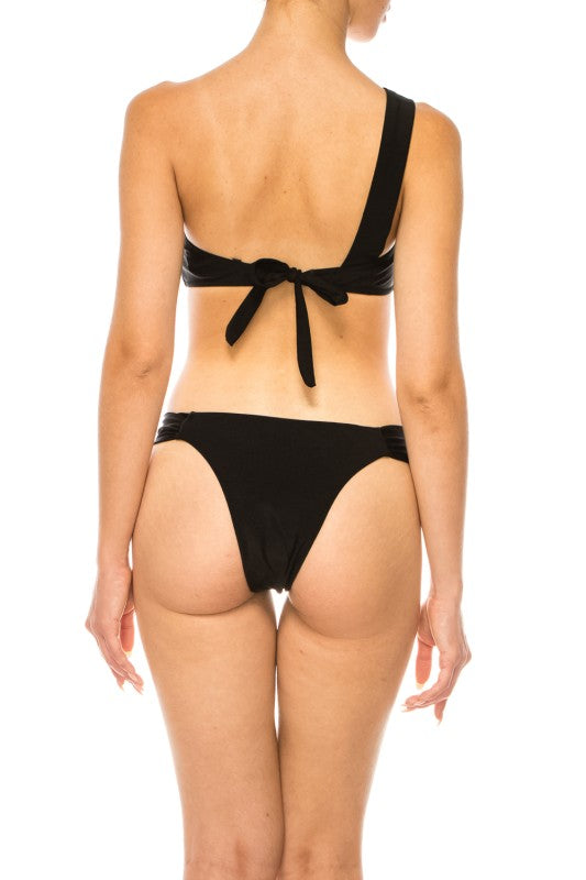 Back view of black Mermaid Swimwear One-Shoulder Bikini with tied bow and high-cut bottoms