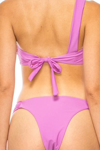 Back view of Mermaid Swimwear One-Shoulder Bikini in pink with tie-back detail