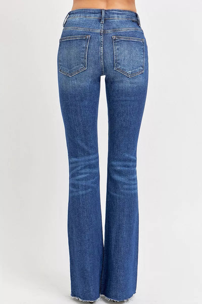 Trendsi Mid Rise Flare Jeans in Dark Wash featuring a fitted waist and flared hem for a trendy look