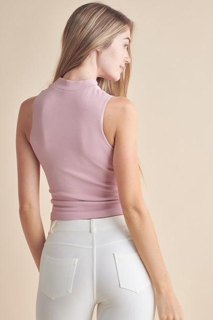 Yelete Mock Neck Tank in soft pink, featuring a fitted design and sleeveless cut for a stylish look.