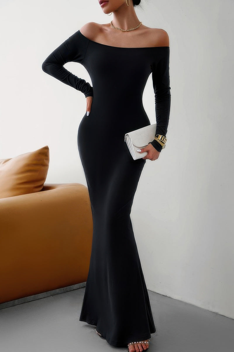 Black off shoulder bodycon dress from CCWHOLESALECLOTHING long sleeve mermaid silhouette holding white clutch and gold jewelry