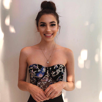 Trendsi Y2K floral embroidered corset top on smiling model strapless black fitted boned bustier