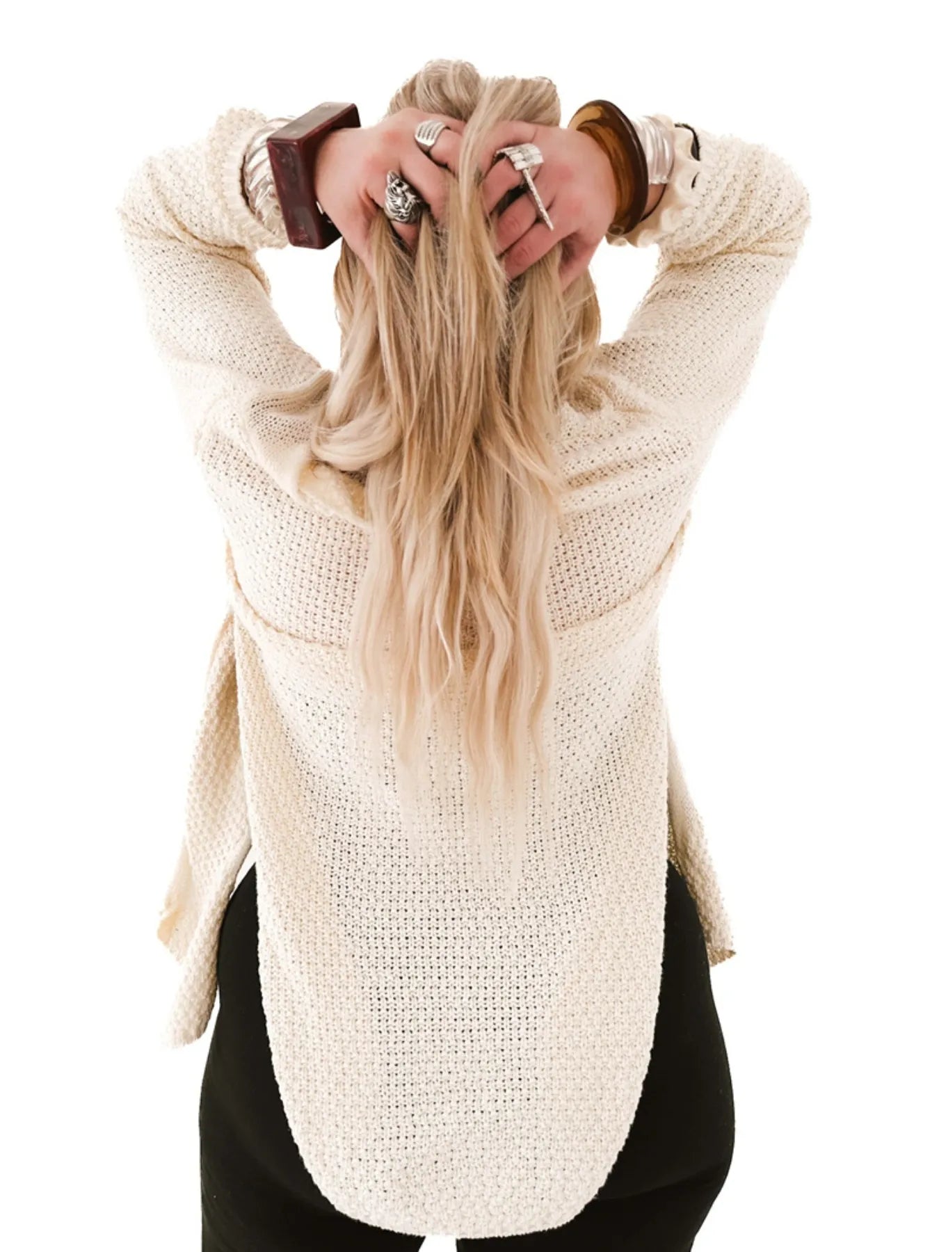 Oversized Knit Cardigan cream back view on model with hands in hair textured loose fit for layering