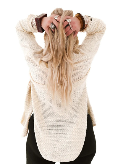 Oversized Knit Cardigan cream back view on model with hands in hair textured loose fit for layering
