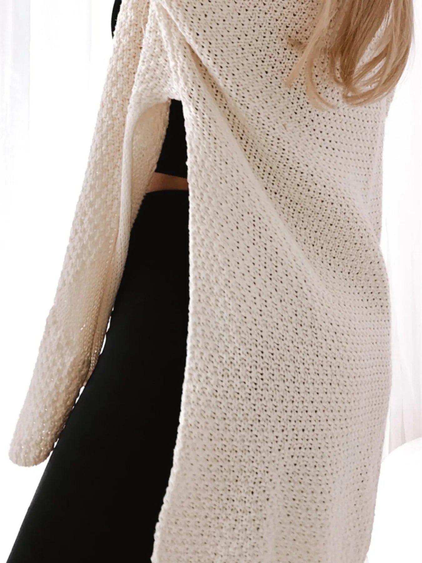 Trendsi Oversized Knit Cardigan in cream open knit with side slit and long sleeves worn over black leggings