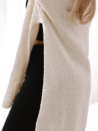 Trendsi Oversized Knit Cardigan in cream open knit with side slit and long sleeves worn over black leggings