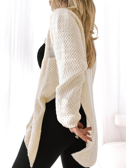 Trendsi model wearing cream textured Oversized Knit Cardigan over black outfit with open front and long drape