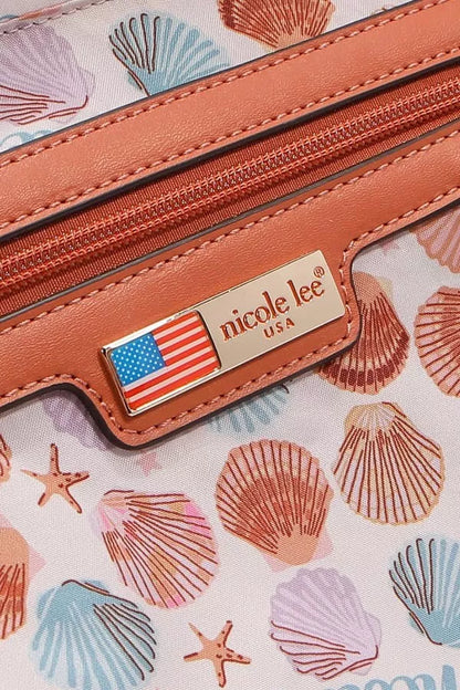 Close-up of a Sand Hobo Handbag with seashell design and Nicole Lee logo detailing