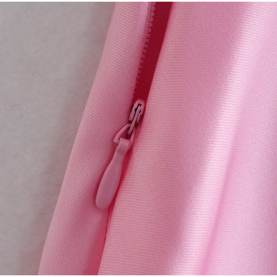 Close-up of zipper detail on a pink satin slip dress showing smooth fabric texture