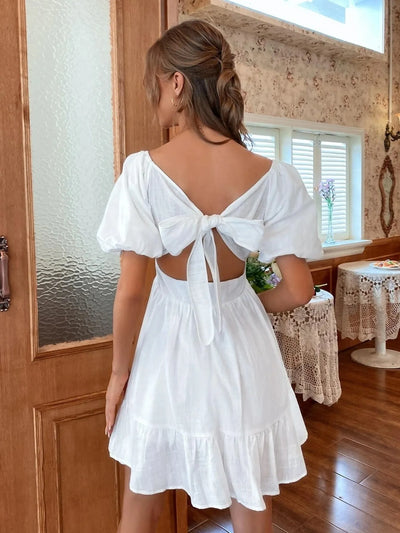 Trendsi Puff Sleeve Mini Dress in White with Open Back Design and Adjustable Tie Detail