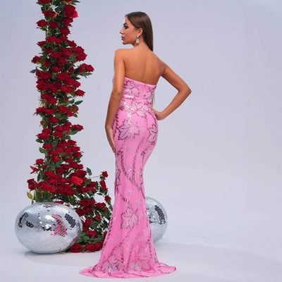 Elegant model showcasing a Romantic Fishtail Wedding Dress in pink with sequined details and a fitted silhouette