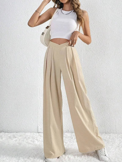 Trendsi Ruched Pants in beige with a relaxed fit, styled with a white crop top and sneakers