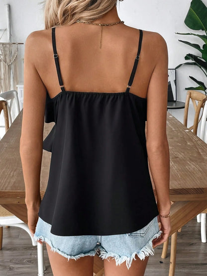 Back view of a black Ruffled Surplice Cami paired with denim shorts for a stylish summer look
