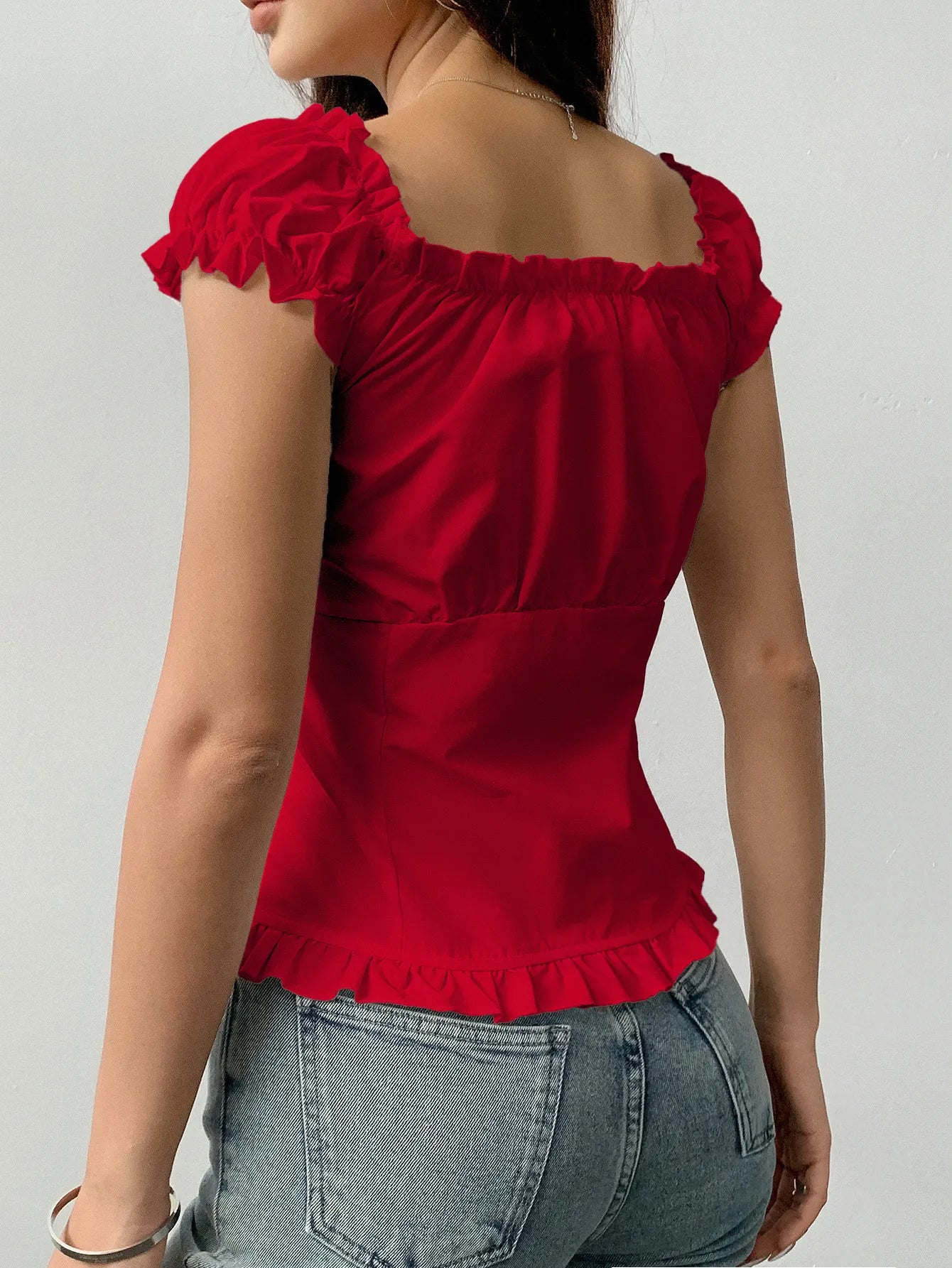Trendsi Scarlet Red Frill Ruched top with puff sleeves and ruffle hem worn with denim jeans