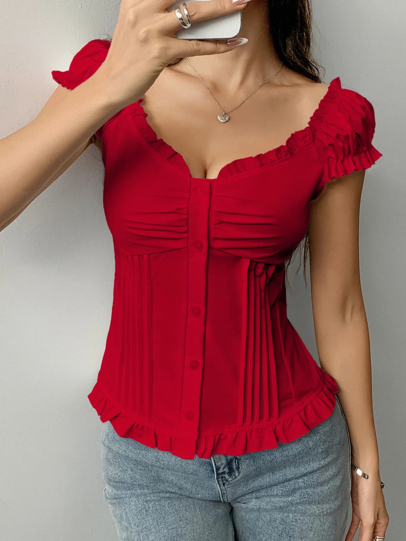 Scarlet Red Frill Ruched top with button front and ruffled sleeves styled with blue jeans