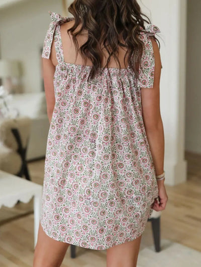 Trendsi Tie Shoulder Mini Dress floral print back view with tie straps elastic smocked yoke casual fit