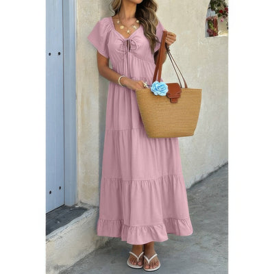 Pink tie front square neck ruffle hem dress with tiered maxi skirt straw tote and sandals
