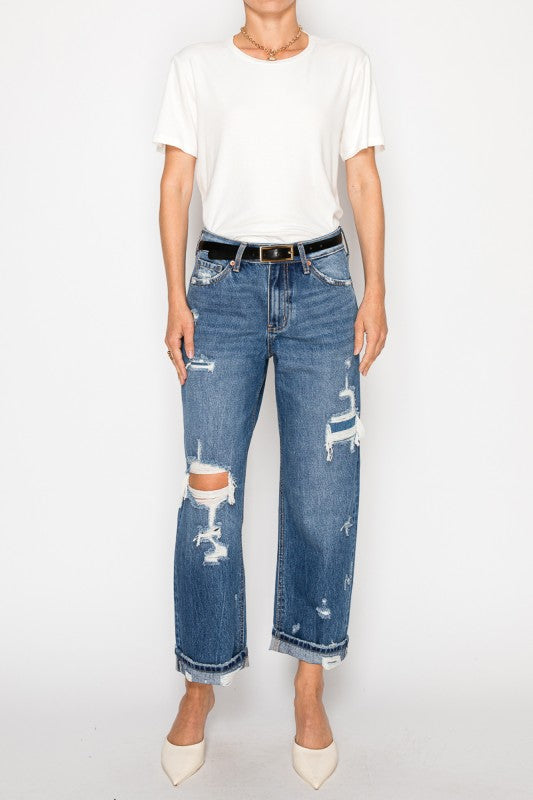 Artemis Vintage women's hybrid high rise jeans distressed straight cropped leg with raw hem on model