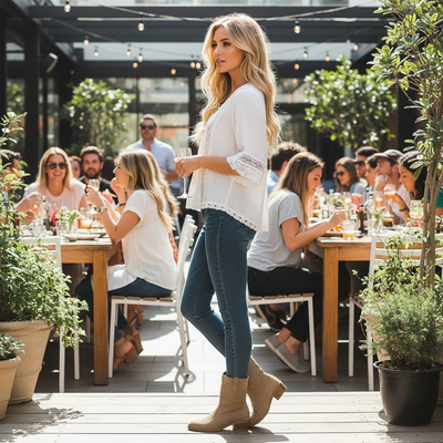 Side view lifestyle image showing block heel of khaki western boots