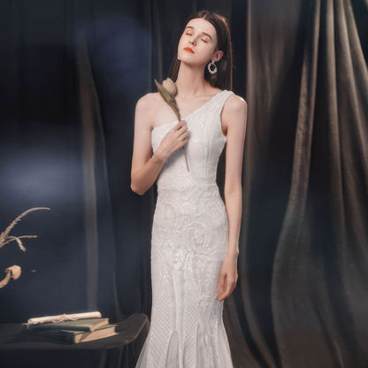 Elegant one-shoulder Slimming Fishtail Wedding Dress featuring intricate lace detailing