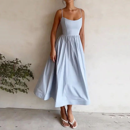 Trendsi solid color summer maxi dress in light blue with spaghetti straps and flowy skirt