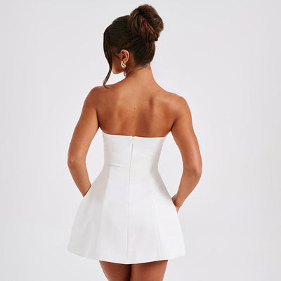 Elegant strapless A-Line mini dress in white featuring a fitted bodice and flared skirt