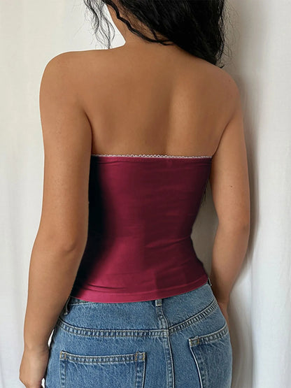 Back view of a burgundy Strapless Tube Top paired with high-waisted denim shorts