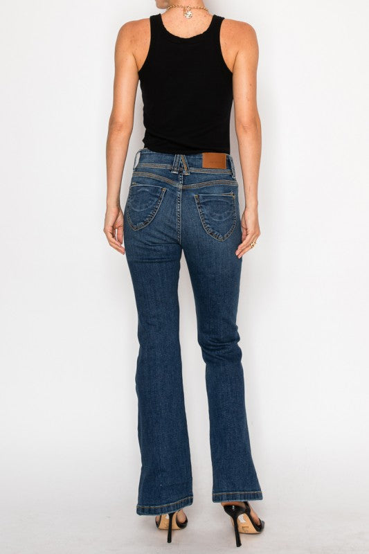 Artemis Vintage High Rise Bootcut Jeans back view on model in dark wash with black tank and heels