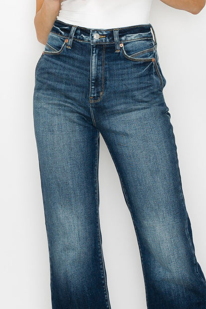 Artemis Vintage High Rise Holly Flare Jeans dark wash front view on model showing high waist and subtle flare