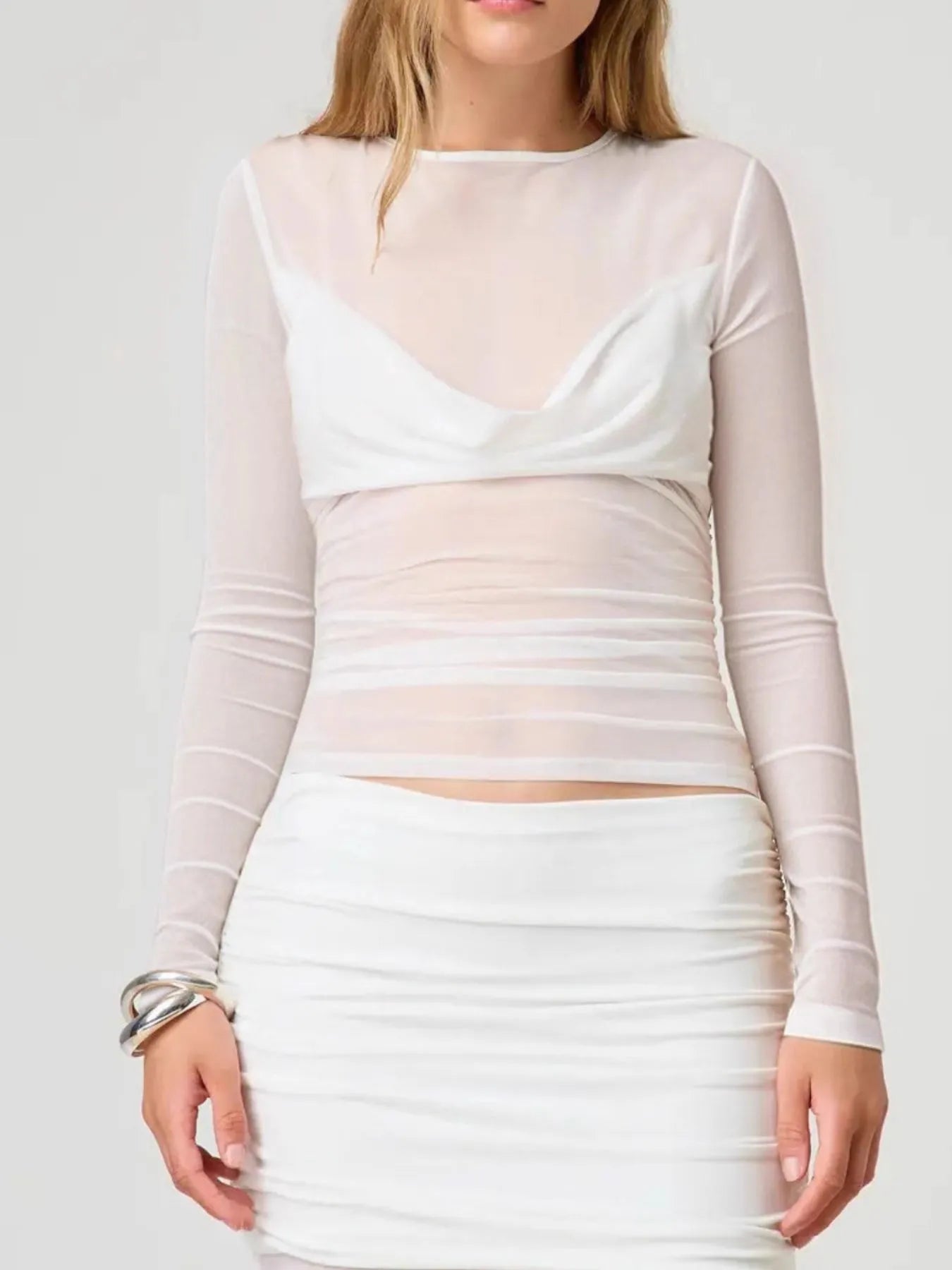Trendsi white sheer Long Sleeve Layering Blouse over matching bralette paired with ruched white skirt