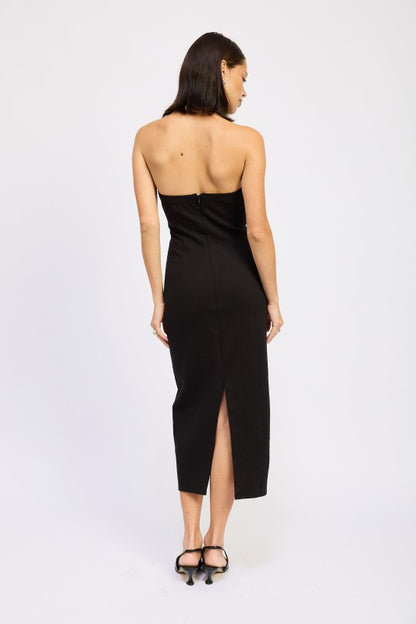 Emory Park model wearing a black open back midi dress strapless fitted silhouette with back slit