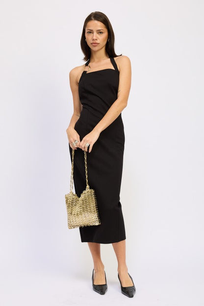 Emory Park black open back midi dress with halter neckline fitted silhouette model holding gold bag