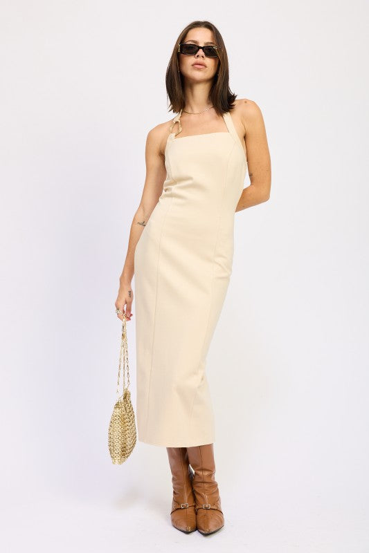 Emory Park open back midi dress in cream on model with sunglasses woven bag and brown ankle boots