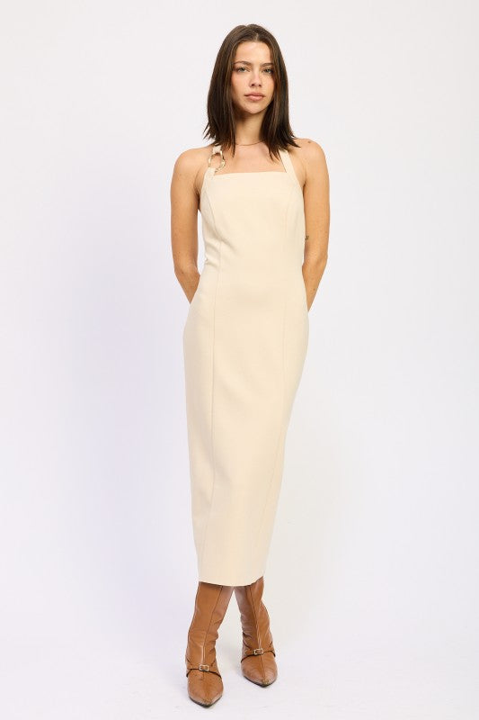 Emory Park cream square neck open back midi dress with thin straps and fitted silhouette paired with brown boots