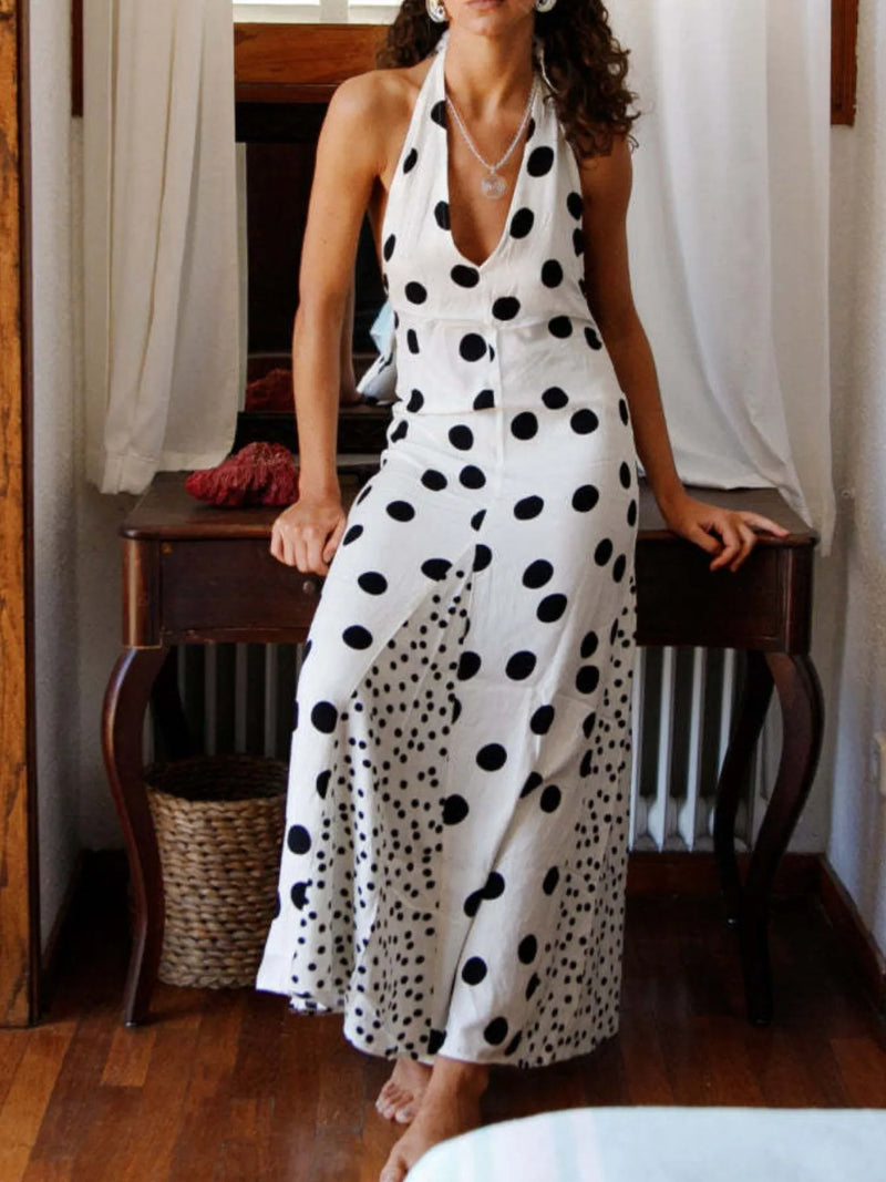 Polka Dot Maxi Dress halter V neck white with black dots fitted waist and front slit worn indoors