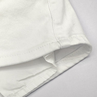 Trendsi white high waist denim shorts close up of folded hem and reinforced seam showing stitching