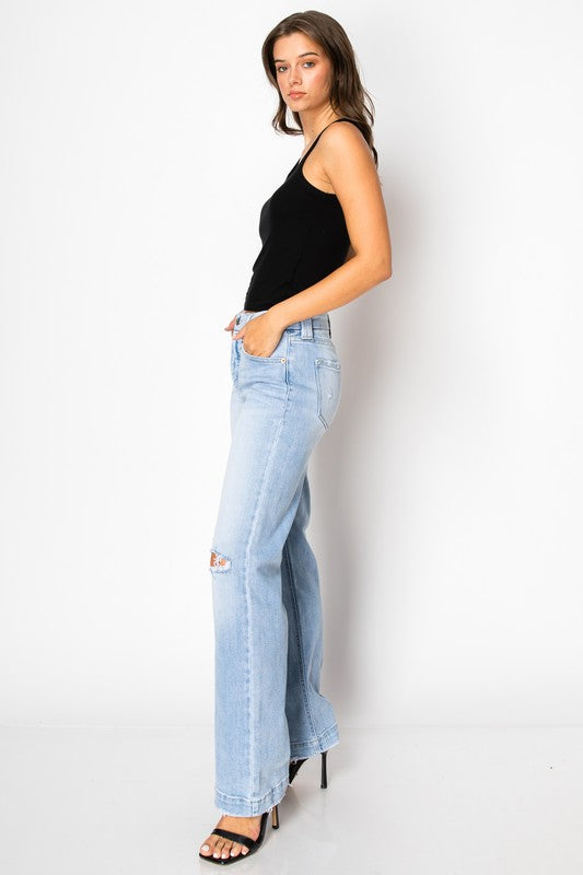 Artemis Vintage light wash high rise women's tummy control jeans wide leg with distressed knee on model