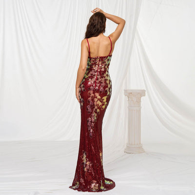 Back view of a stunning sequined fishtail wedding dress in burgundy with floral accents