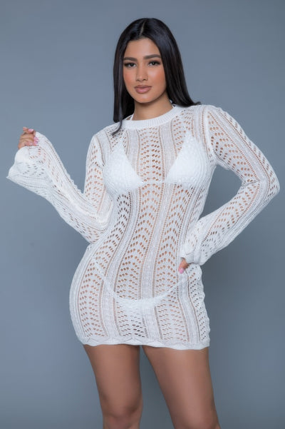 Model wearing white long sleeve crochet mini dress by CCWHOLESALECLOTHING also available in black crochet mini dress