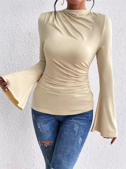 Trendsi beige long sleeve bell sleeve ruched side mock neck Fitted T-Shirt styled with jeans