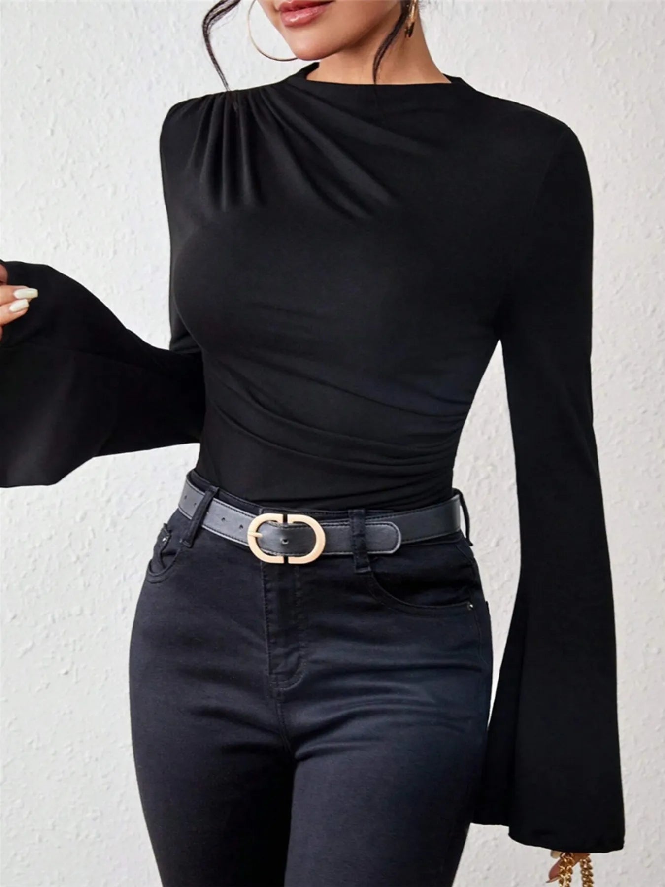 Trendsi black long sleeve mock neck Fitted T-Shirt with bell sleeves and ruched shoulder paired with high waisted jeans