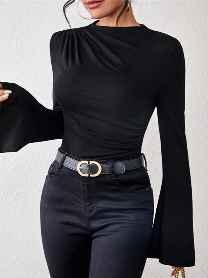 Trendsi black long sleeve mock neck Fitted T-Shirt with bell sleeves and ruched shoulder paired with high waisted jeans