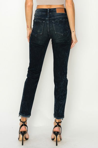 Artemis Vintage women's mid rise cigarette jeans back view in black washed denim with raw ankle hem