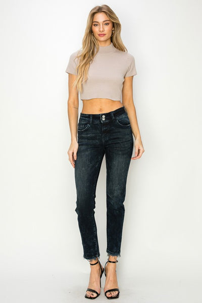 Artemis Vintage women's mid rise cigarette jeans in black washed denim with raw ankle hem on model