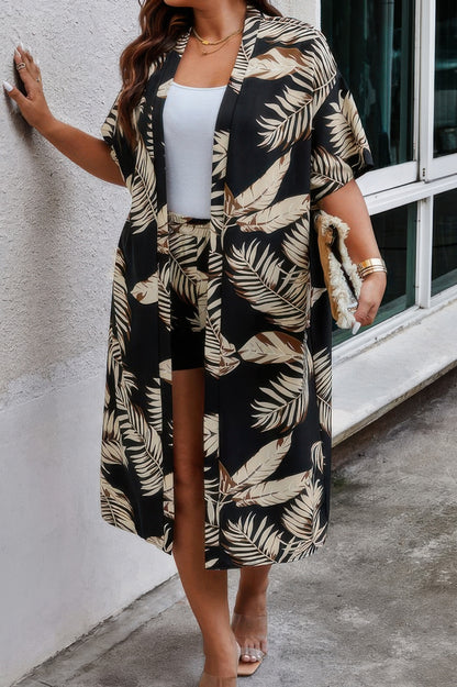 Curvy model wearing plus size leaf print shorts set with matching long duster in black and beige over white tank