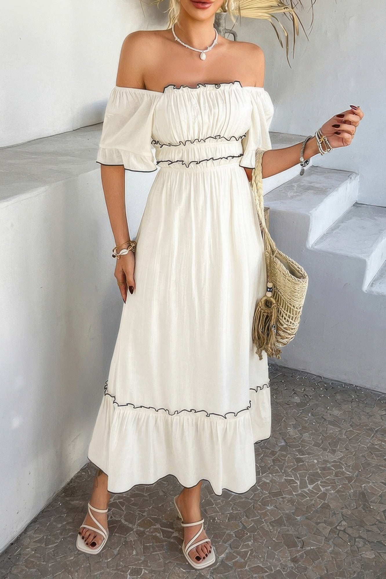 White off shoulder bodycon dress with ruffle bandeau top elastic waist black trim midi length and straw bag